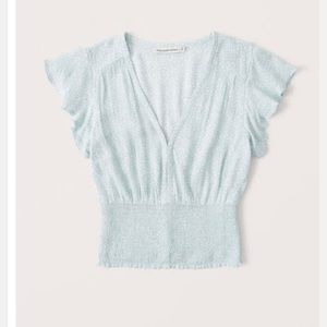 Brand new Short sleeve smocked waist flutter sleeve blouse light blue pattern